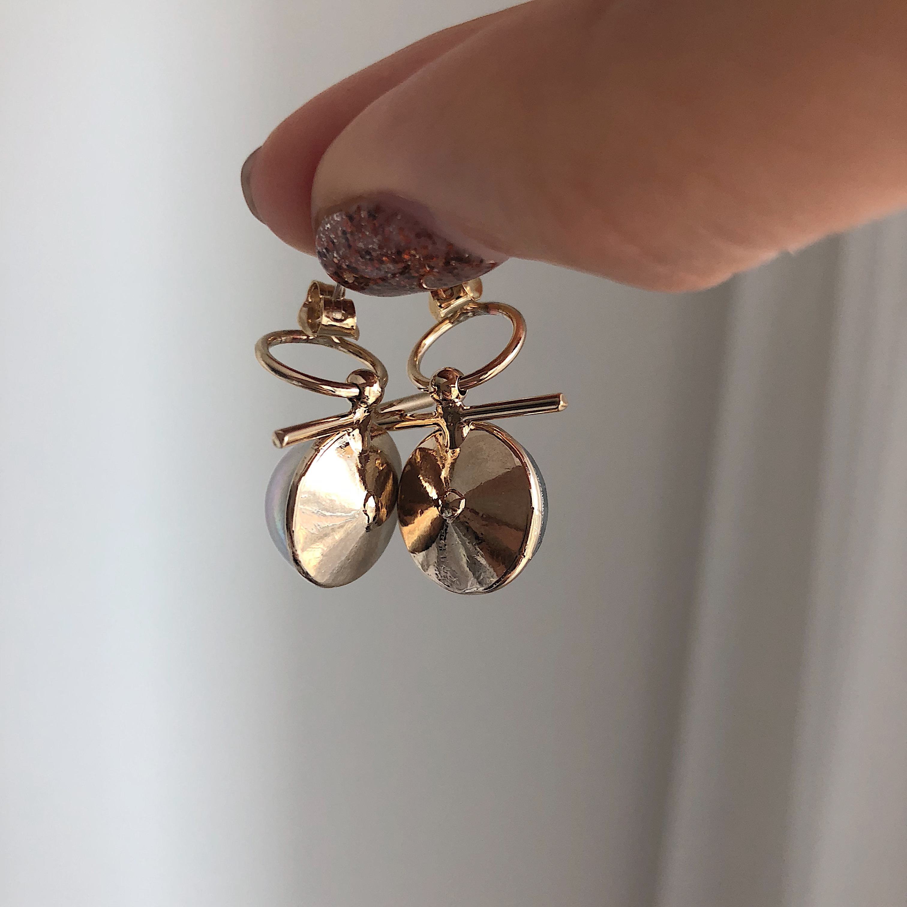 mood mud unbalanced earrings bold gold silver pear