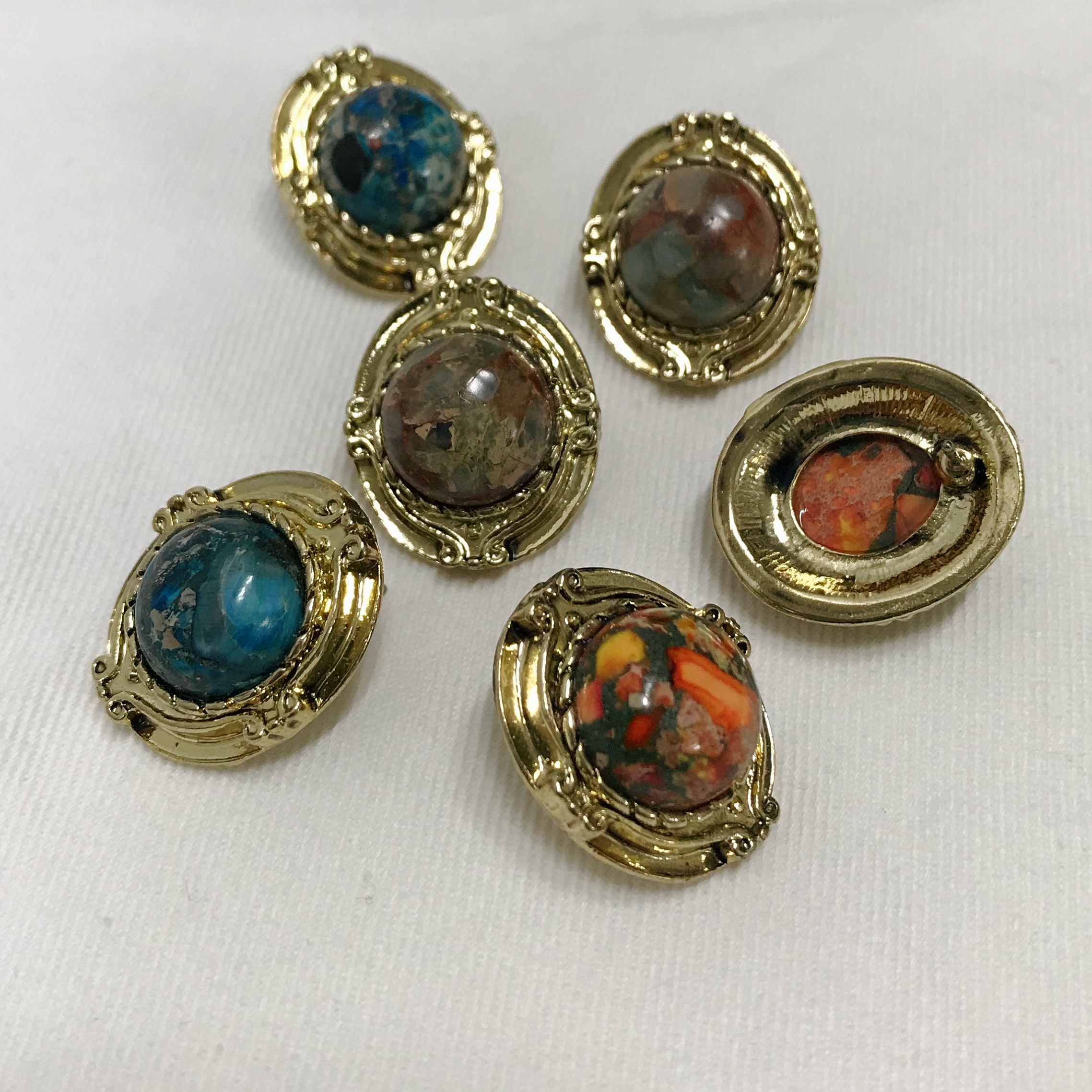 Hamaica earrings titanium spikes antique stone bol