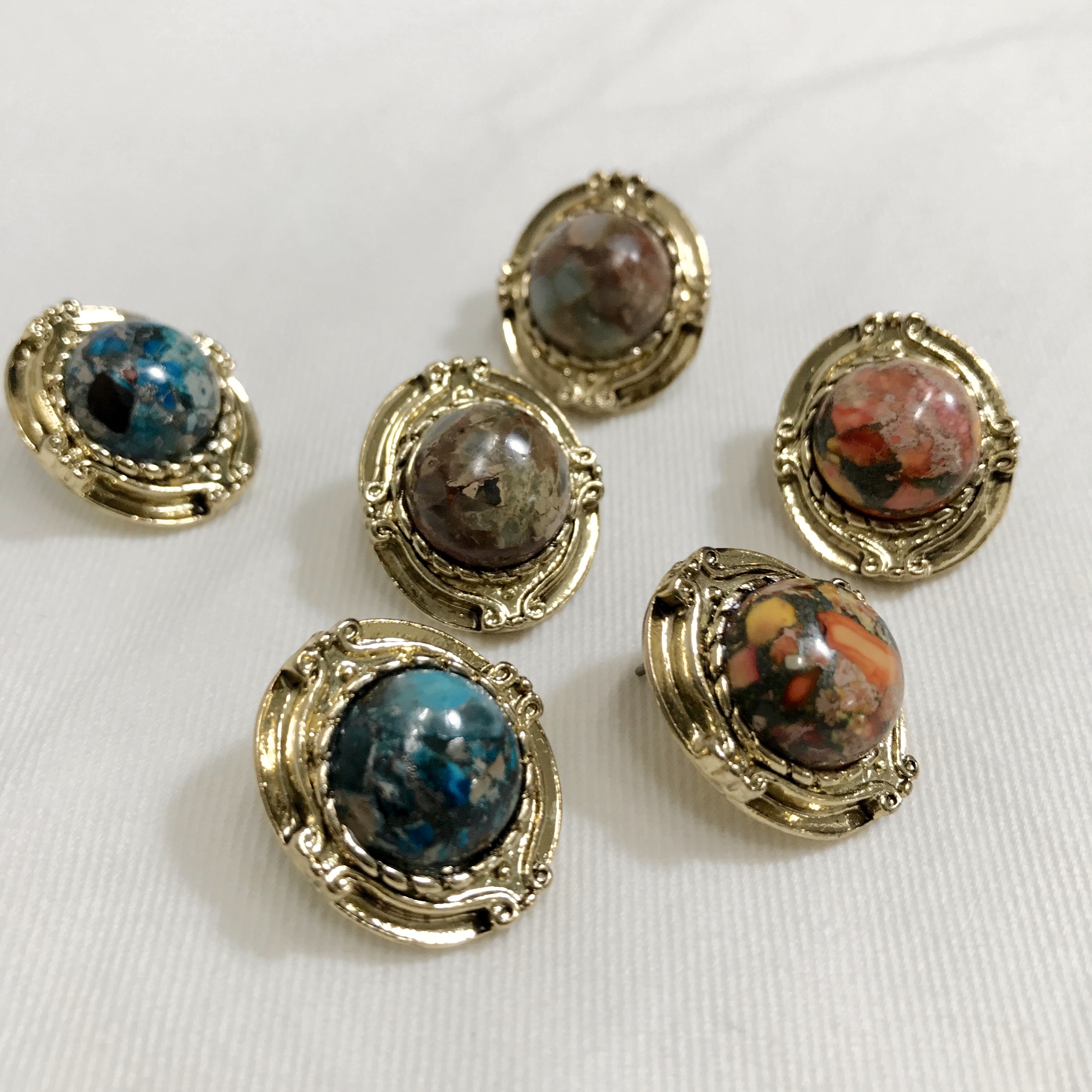 Hamaica earrings titanium spikes antique stone bol