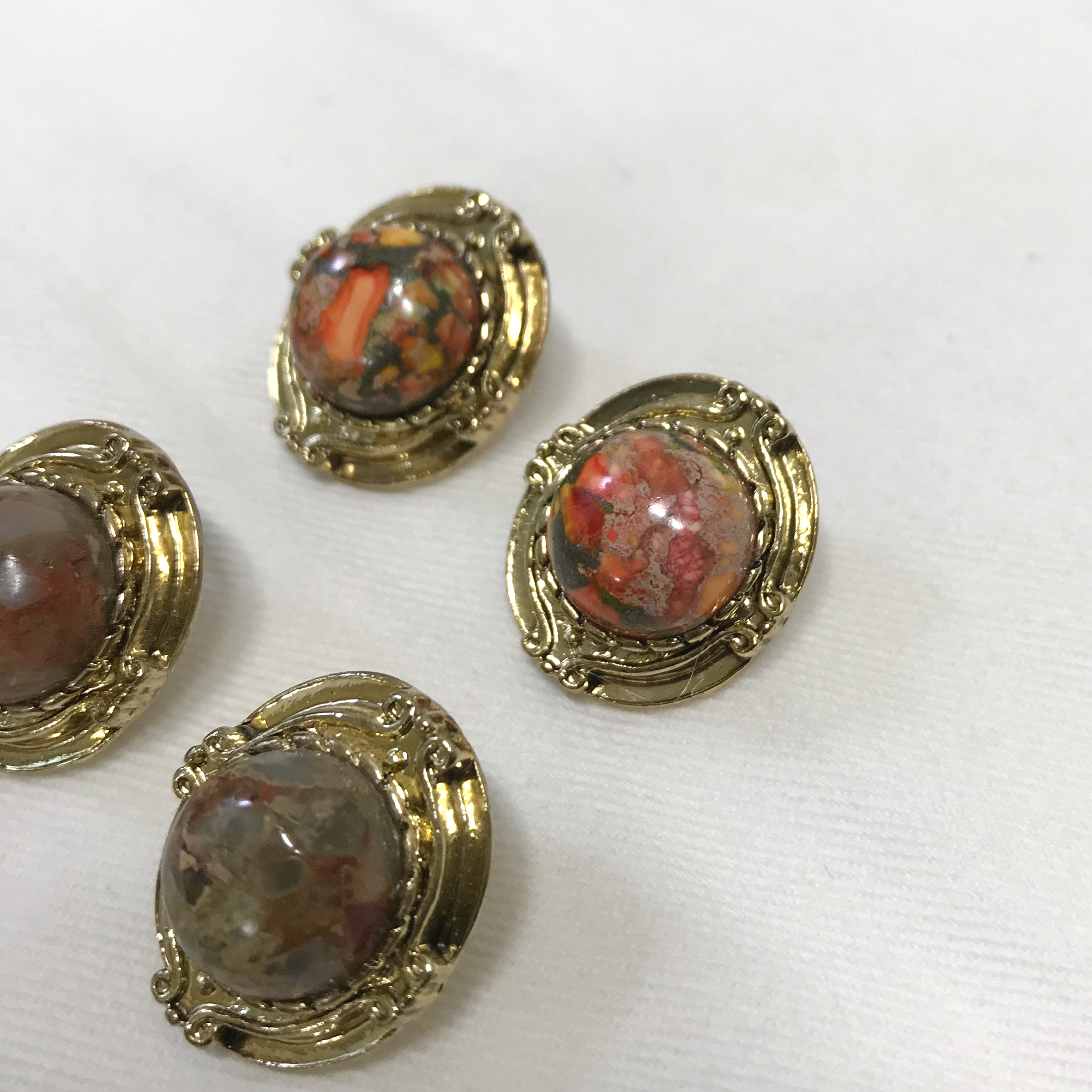 Hamaica earrings titanium spikes antique stone bol