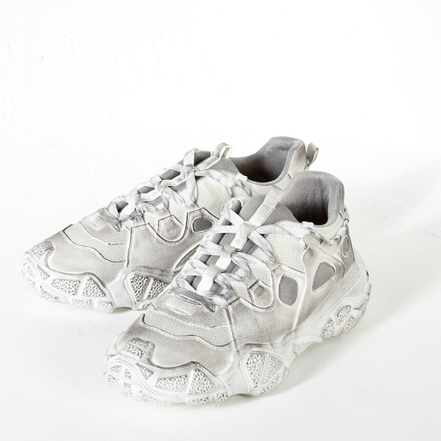 Stained white ugly sneakers