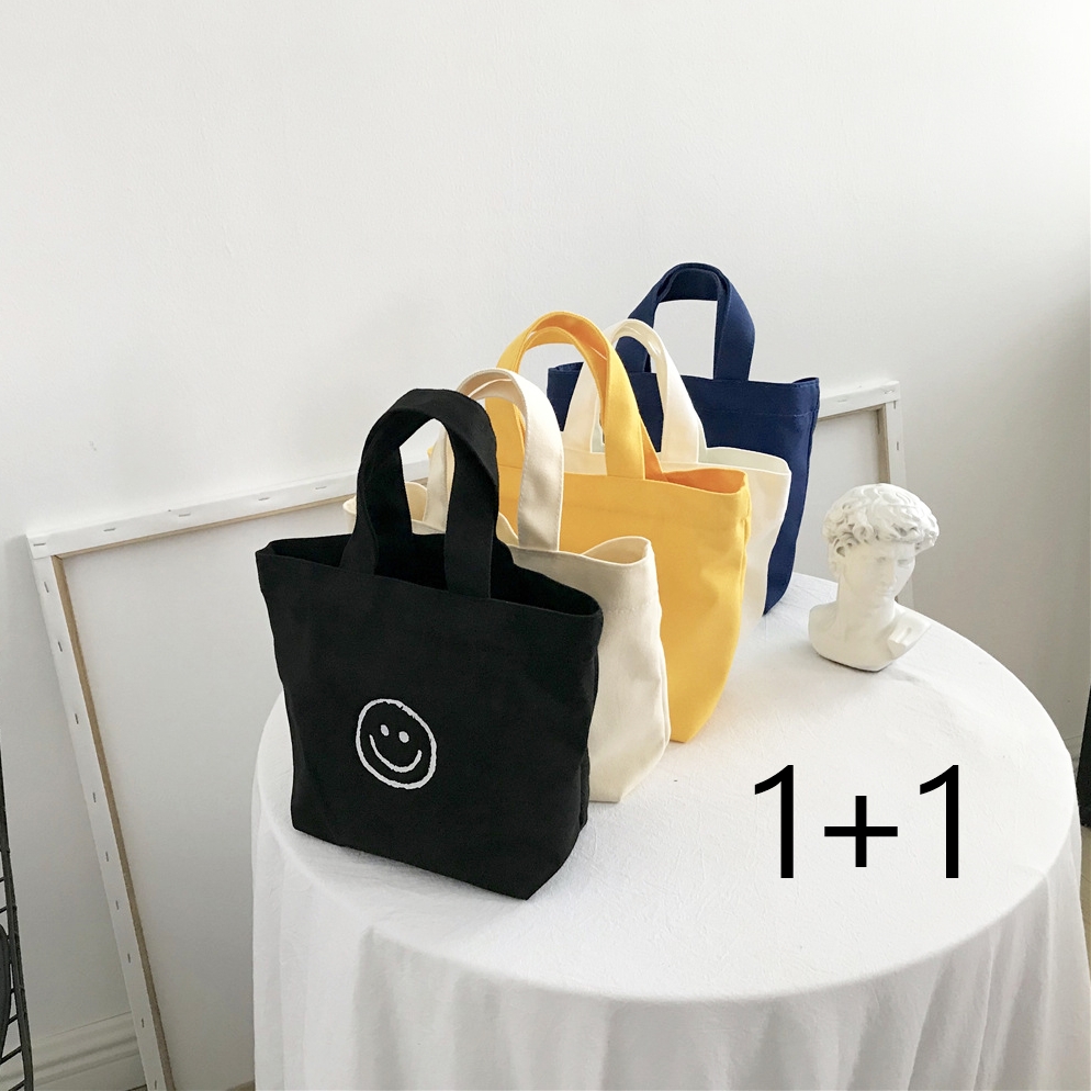 뷰레이터닷컴 1+1 위스퍼 스마일 미니 캔버스 에코백