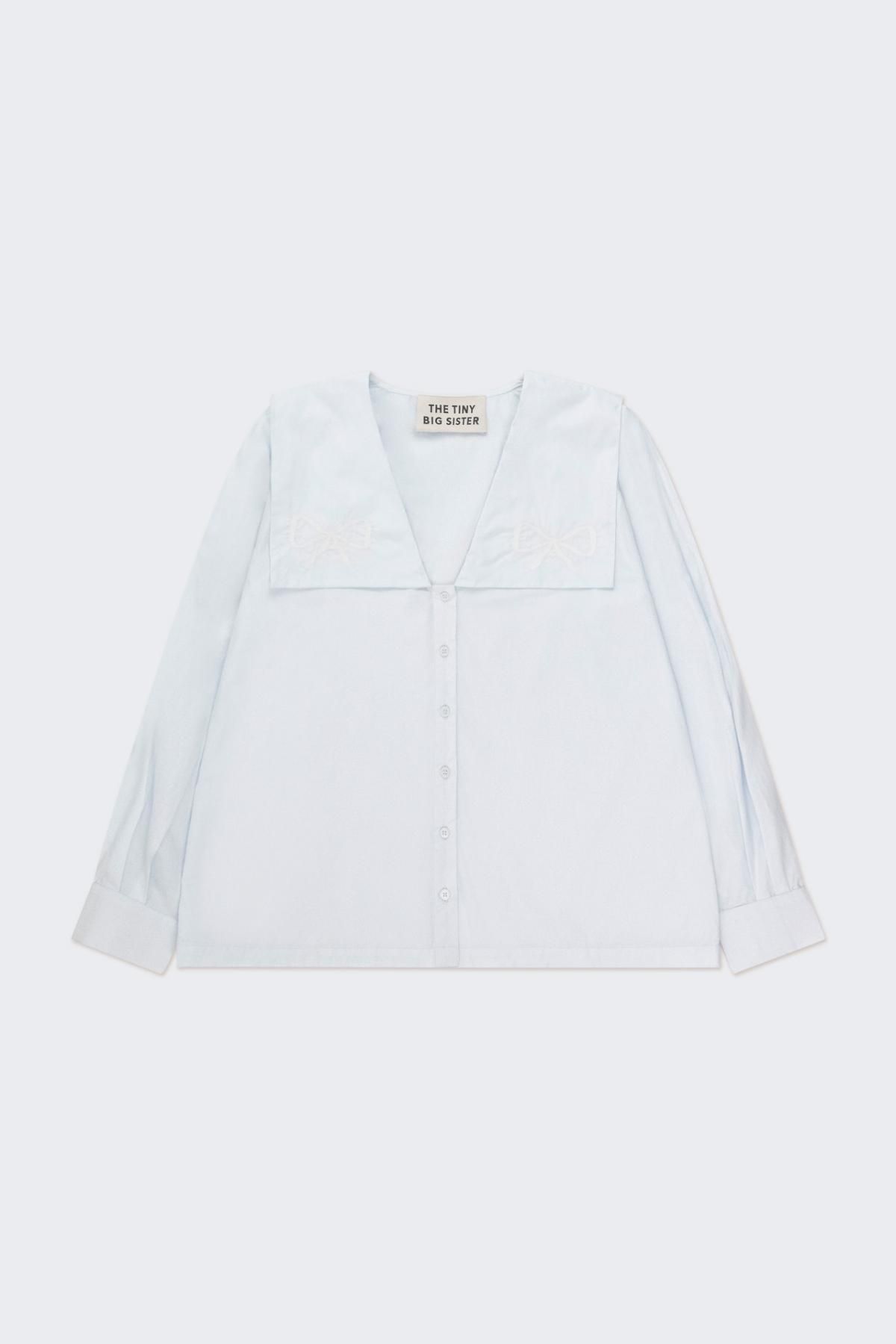 타이니코튼 모던 화이트 브이넥 리본 블라우스 AW24-624J24 ONE COLOR - 상품 이미지